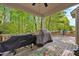Outdoor deck featuring grilling area and seating, ideal for entertaining with views of the backyard at 190 Bingham Creek Dr, Garner, NC 27529