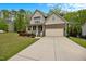 Charming two-story home with stone accents, a covered porch, and a two car garage at 190 Bingham Creek Dr, Garner, NC 27529