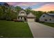 Attractive two-story home with manicured lawn and covered porch, featuring a two-car garage and stone accents at 190 Bingham Creek Dr, Garner, NC 27529