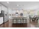 Bright, modern kitchen with a large island, stainless steel appliances, and a dining area at 190 Bingham Creek Dr, Garner, NC 27529