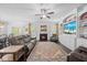 Open-concept living room with fireplace, hardwood floors, and a sliding door to the exterior at 190 Bingham Creek Dr, Garner, NC 27529