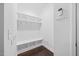 Mud room with storage shelves, hooks, and seating bench at 190 Bingham Creek Dr, Garner, NC 27529