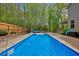 Inviting swimming pool with lounge furniture and a privacy fence at 190 Bingham Creek Dr, Garner, NC 27529