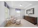 Bedroom sitting area with a chair, ottoman, mirror and dresser at 190 Bingham Creek Dr, Garner, NC 27529