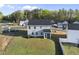 Aerial view of the home's backyard, with a screened porch and expansive lawn at 20 Carolina Maple Dr, Franklinton, NC 27525