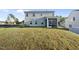 Spacious backyard featuring lush grass leading up to the home with a screened porch at 20 Carolina Maple Dr, Franklinton, NC 27525