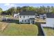 Aerial view of the home's backyard, with a screened porch and expansive lawn at 20 Carolina Maple Dr, Franklinton, NC 27525