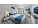 This bedroom features a tufted headboard, blue accents, and decorative art at 20 Carolina Maple Dr, Franklinton, NC 27525