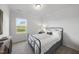 Cozy bedroom with a metal frame bed, soft carpet, and a window that provides natural light at 20 Carolina Maple Dr, Franklinton, NC 27525