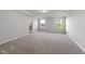 Spacious, empty bedroom featuring neutral carpet and a bright atmosphere with natural light at 20 Carolina Maple Dr, Franklinton, NC 27525