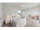 bedroom featuring a bed with a cushioned headboard, neutral walls and a window at 20 Carolina Maple Dr, Franklinton, NC 27525