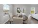 Bright dining area with a round wood table, surrounded by cushioned chairs and a large window offering natural light at 20 Carolina Maple Dr, Franklinton, NC 27525