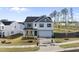 Charming two-story home with a well-manicured lawn, a two-car garage, and inviting curb appeal at 20 Carolina Maple Dr, Franklinton, NC 27525