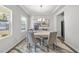 Bright and inviting office space featuring a modern chandelier and a large window with natural light at 20 Carolina Maple Dr, Franklinton, NC 27525