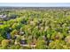 Stunning aerial view showcases lush greenery surrounding homes, creating a peaceful neighborhood ambiance at 201 Dunhagan Pl, Cary, NC 27511