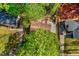 Aerial view of home showcasing roof, deck, driveway and proximity to mature trees at 201 Dunhagan Pl, Cary, NC 27511