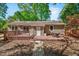 Beautiful backyard features wood deck and patio, privacy fence, mature trees, and lush landscaping at 201 Dunhagan Pl, Cary, NC 27511