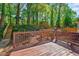 Great backyard with wood deck, stairs, fence, and trees at 201 Dunhagan Pl, Cary, NC 27511
