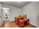 Spacious bedroom features wood floors, adjacent bath and charming doll house and chest at 201 Dunhagan Pl, Cary, NC 27511