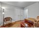 Comfortable bedroom with wood floors, white closet doors, and a view to an adjacent room at 201 Dunhagan Pl, Cary, NC 27511