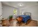 Relaxing bedroom with hardwood floors, a window overlooking the garden, and neutral paint at 201 Dunhagan Pl, Cary, NC 27511