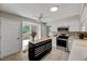 Modern kitchen with stainless steel appliances, tile backsplash, and ample counter space at 201 Dunhagan Pl, Cary, NC 27511