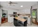 Bright kitchen featuring white cabinetry, stainless steel appliances, and stylish backsplash at 201 Dunhagan Pl, Cary, NC 27511