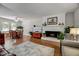 Open-concept living area featuring a brick fireplace, and hardwood flooring at 201 Dunhagan Pl, Cary, NC 27511