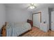 Bright bedroom with wood floors, closet and neutral paint perfect for rest and relaxation at 2024 Country Trails Dr, Clayton, NC 27520