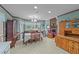 Bright dining area featuring a chandelier, tile flooring, and traditional wood furniture at 2024 Country Trails Dr, Clayton, NC 27520