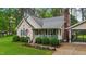 Exterior view of home showing well-kept yard, carport, and charming curb appeal at 2024 Country Trails Dr, Clayton, NC 27520