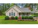 Inviting home exterior with neat landscaping and a welcoming front porch at 2024 Country Trails Dr, Clayton, NC 27520