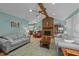 Bright living room boasts brick fireplace, ceiling fan, and ample seating at 2024 Country Trails Dr, Clayton, NC 27520