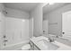 Clean bathroom showcasing a shower/tub combo, a vanity with countertop, and a mirrored wall at 205 Fig Tree Bnd, Zebulon, NC 27597