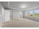 Open bedroom featuring a walk-in closet, ensuite bathroom, and pleasant backyard scenery at 205 Fig Tree Bnd, Zebulon, NC 27597