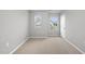 Versatile bedroom featuring natural light, neutral walls, and a door leading to another room at 205 Fig Tree Bnd, Zebulon, NC 27597