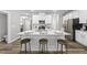 Well-lit kitchen featuring a large island with seating and modern appliances at 205 Fig Tree Bnd, Zebulon, NC 27597
