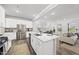 Modern kitchen featuring an island, stainless steel appliances, and an open layout at 205 Fig Tree Bnd, Zebulon, NC 27597