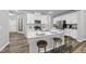 Well-lit kitchen featuring a large island with seating and modern appliances at 205 Fig Tree Bnd, Zebulon, NC 27597
