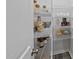 Walk-in pantry with metal shelving for organized storage of food items at 205 Fig Tree Bnd, Zebulon, NC 27597