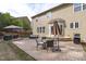 Cozy back patio with brickwork, outdoor seating, and an umbrella, perfect for relaxing and entertaining guests at 2109 Hemlock Hill Dr, Durham, NC 27703