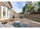 Spacious backyard features a patio area with a table and chairs, a cozy sofa on a rug, and beautiful landscaping at 2109 Hemlock Hill Dr, Durham, NC 27703