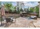 A backyard patio with an outdoor kitchen, dining area, and seating area at 2109 Hemlock Hill Dr, Durham, NC 27703