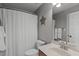 Bathroom with shower and tub combo, white shower curtain, and a wood vanity at 2109 Hemlock Hill Dr, Durham, NC 27703