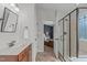 Modern bathroom with a glass shower and a view into the bedroom at 2109 Hemlock Hill Dr, Durham, NC 27703