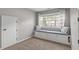 Cozy bedroom features a built-in window seat with storage and soft natural light at 2109 Hemlock Hill Dr, Durham, NC 27703