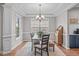 Dining area featuring elegant trim, hardwood floors, and plenty of natural light at 2109 Hemlock Hill Dr, Durham, NC 27703