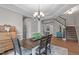 Dining area featuring elegant hardwood floors and easy access to the staircase at 2109 Hemlock Hill Dr, Durham, NC 27703