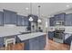 Well-equipped kitchen with stainless appliances, central island, and modern cabinetry, perfect for cooking and entertaining at 2109 Hemlock Hill Dr, Durham, NC 27703
