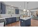 Open kitchen design with a center island, modern appliances, and easy access to the dining area and outdoor spaces at 2109 Hemlock Hill Dr, Durham, NC 27703
